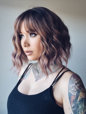 We should let the reviews speak for this one! This natural twist of brown shadowed roots that melt into a muted pink and plum mix ombre. A loose wave bob with a sleek fringe.