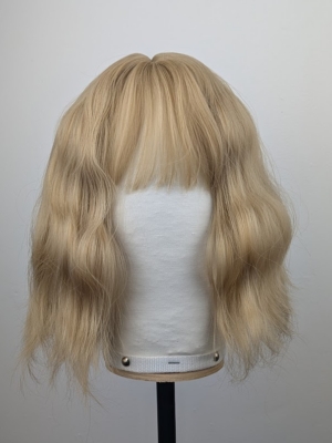 Outlet #164 - Lush Wigs UK This bob has very loose tousled waves. A light blonde shade from roots to tips. With a sleek blunt fringe.