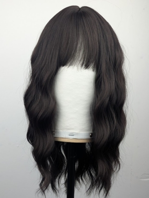 Outlet #166 - Lush Wigs UK This long bob (lob) comes in a very dark brown cocoa shade from roots to tips. Styled in loose tousled waves with layers and a blunt sleek fringe.