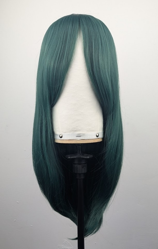 Outlet #172 - Lush Wigs UK This dark green wig from roots to tips. Styled sleek with long layers falling to the waist. The fringe is long and sleek, wear it to the side or parted for curtain bangs.