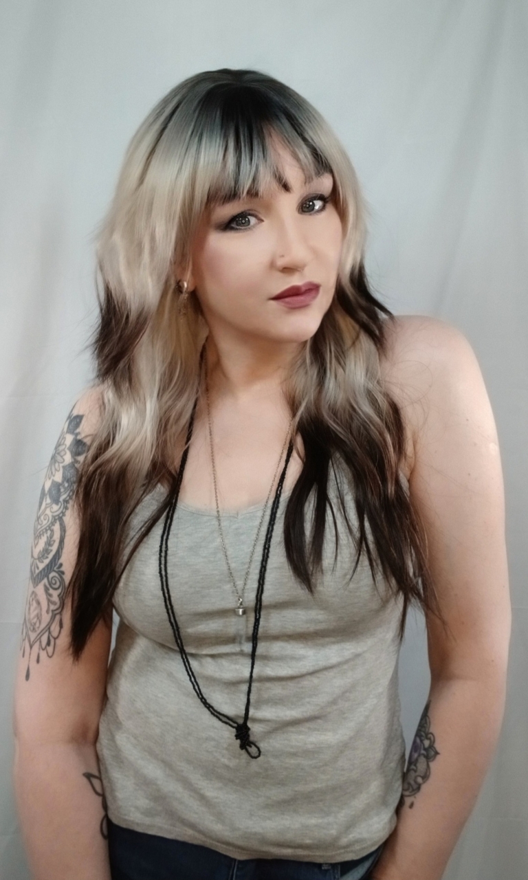 Alyne - Lush Wigs UK This natural wig comes in a mix of ash blonde roots. They blend into a warm brown hue for a dip dye effect on the ends. A sleek long style with long layers at the back, face framing layers at the front make this style easy to maintain. With a sleek blunt fringe finishes the look.