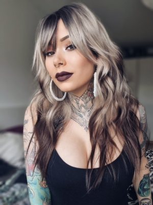 Alyne - Lush Wigs UK This natural wig comes in a mix of ash blonde roots. They blend into a warm brown hue for a dip dye effect on the ends. A sleek long style with long layers at the back, face framing layers at the front make this style easy to maintain. With a sleek blunt fringe finishes the look.