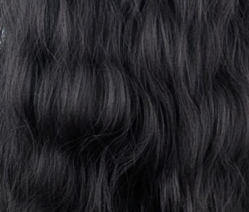 A very dark brown colour from roots to tips. Styled in loose waves that fall to the waist. Long invisible layers to add body and movement to the look. With a sleek blunt fringe.