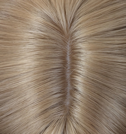 Aurelia - Lush Wigs UK This natural wig comes in a mix of caramel blonde from roots to tips. A Voluminous curly style, cut into face framing layers at the front. With a sleek blunt fringe that finishes the look.