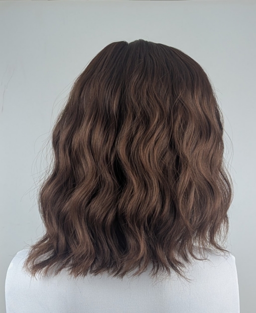 Chai - Lush Wigs UK Chai is a natural and simple bob style that comes in a light brown colour. Styled in loose beachy waves for texture.