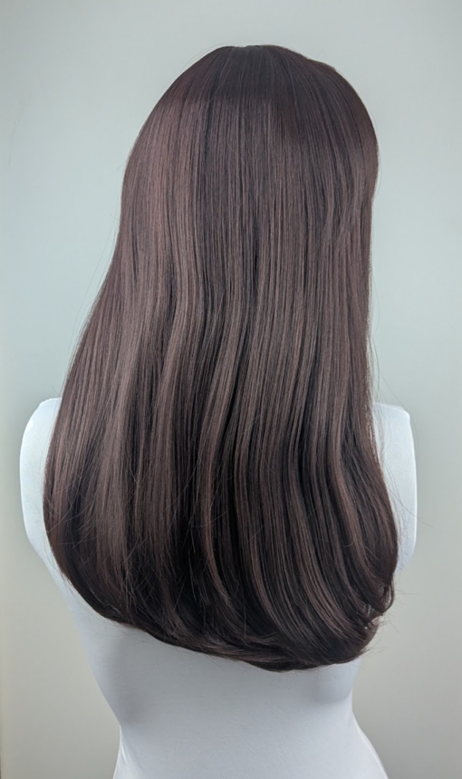 Chocolate - Lush Wigs UK This natural wig is a mix of warm auburn and brown colours with russet undertones. Styled sleek with long layers at the front. A full blunt fringe gives a full volume look to this medium-long layered style.