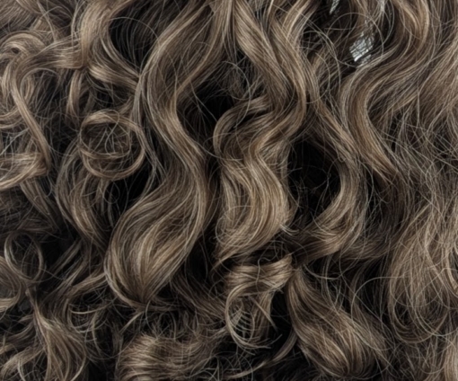 Echo - Lush Wigs UK This wig comes in a light chestnut colour from roots to tips. Lots of volume with its abundance of curls that fall just past the shoulders. A sleek full blunt fringe finishes the look.