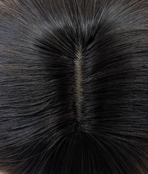 Embers - Lush Wigs UK A dark apricot wig with brown shadowed roots. Styled into a bob with loose waves and a sleek blunt fringe.