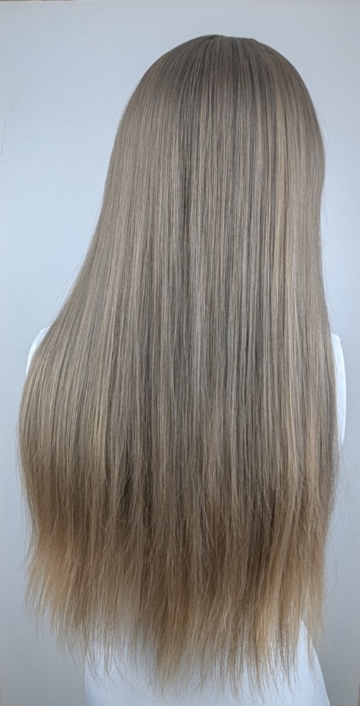 Grey Skies - Lush Wigs UK This wig has a mixture of sandy and mushroom blonde tones from the roots to ash blonde dip dye tips. Styled sleek with long layers falling to the waist. The fringe is long and sleek.