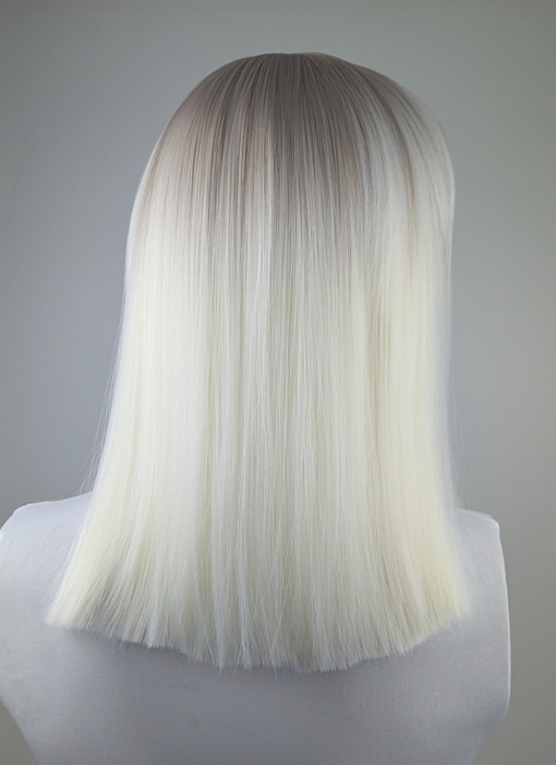 Lorna - Lush Wigs UK Lorna is a rework of the platinum blonde colour with a muted lemon undertone, producing a bleach blonde effect. A sprinkle of sandy blonde roots, creating a natural feel. Poker straight, long one length bob (lob) with a sleek full blunt fringe.