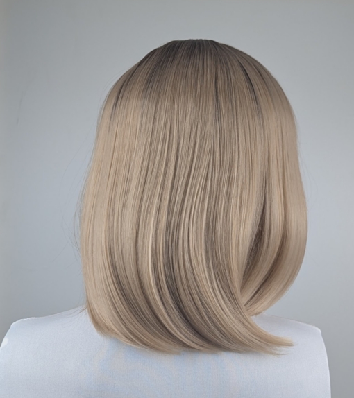 Myrtle - Lush Wigs UK This sandy natural blonde wig is simple and chic. Brown shadowed roots melt into a blonde hue with sun-kissed tips that create the perfect shades for a natural look. A straight one-length bob that curls under at the ends.