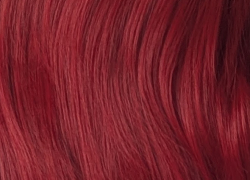 This sleek style comes in a vivid fire engine red colour from roots to tips. Cut into long layers that fall to the waist. Finished in a barrel brush blow out, with a sleek blunt fringe.