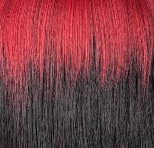 Adore - Lush Wigs UK This glam rock throwback shaggy cut sleek style has red roots and a full red fringe. Cool black tone with a peek a boo red from the nape of the neck.