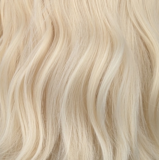 This natural bob comes in a light blonde tone from roots to tips. Styled into a loose flat iron effect wave, that's easy to wear and maintain. A sleek blunt fringe frames the face.