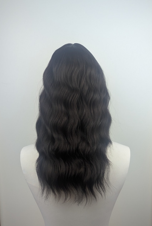 Mayonaka - Lush Wigs UK This natural medium length wig comes in a very dark mix of black and a deep brown cocoa tone. From roots to tips. Styled in loose tousled waves with layers and a blunt sleek fringe.
