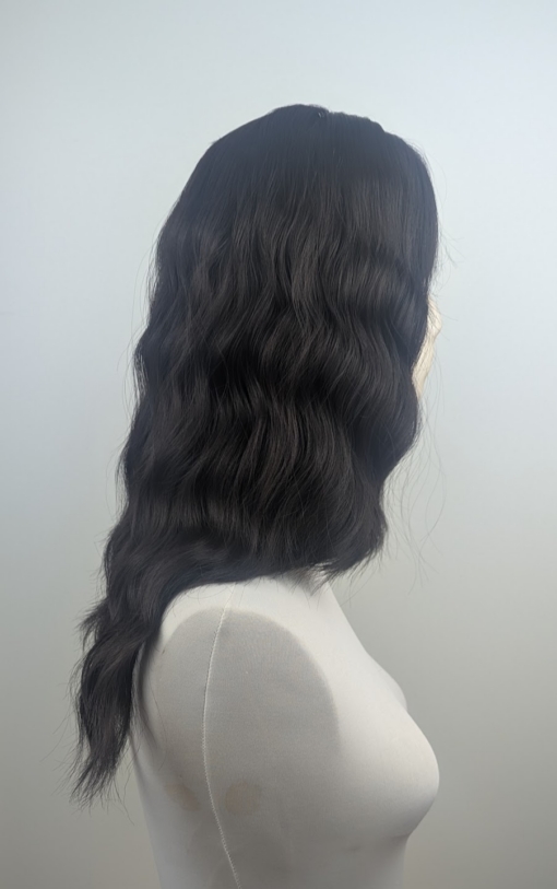 Mayonaka - Lush Wigs UK This natural medium length wig comes in a very dark mix of black and a deep brown cocoa tone. From roots to tips. Styled in loose tousled waves with layers and a blunt sleek fringe.