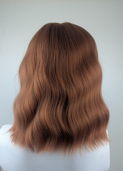 Rooibos - Lush Wigs UK This relaxed wavy bob falls just above the shoulders. In a natural Warm apricot colour from root to tips. It's sleek long fringe is versatile to be worn to suit your look.