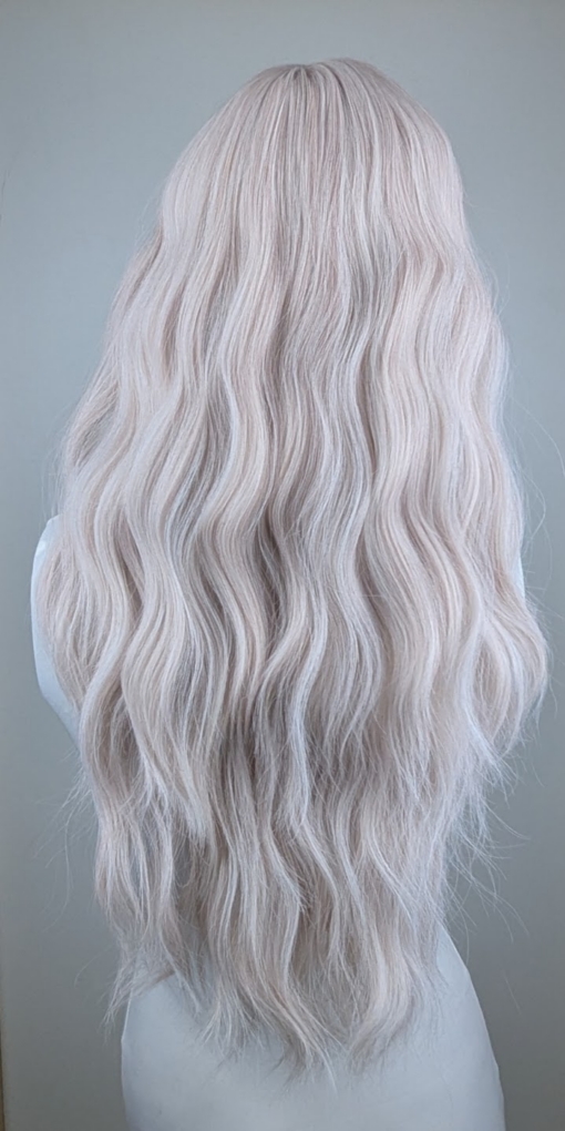 Songbird - Lush Wigs UK This creamy white wig has a hint of subtle pink from roots to tips. Styled into loose barrel curls. With a sleek blunt fringe.