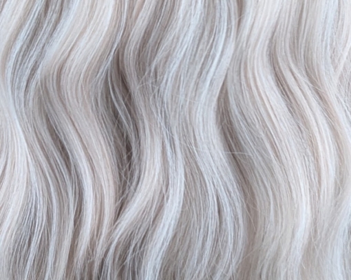 Songbird - Lush Wigs UK This creamy white wig has a hint of subtle pink from roots to tips. Styled into loose barrel curls. With a sleek blunt fringe.