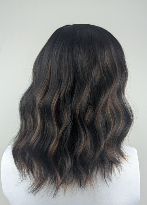 Swirl - Lush Wigs UK Swirl is defined by its warm coffee coloured low-lights, running throughout this very dark brown bob. Styled in gentle waves with a sleek blunt fringe.