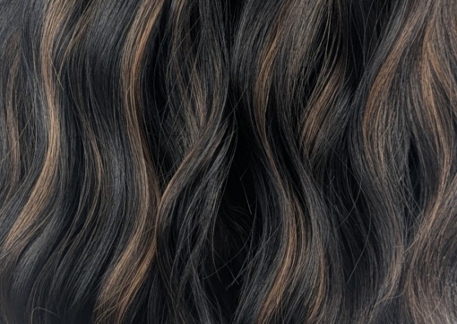 Swirl - Lush Wigs UK Swirl is defined by its warm coffee coloured low-lights, running throughout this very dark brown bob. Styled in gentle waves with a sleek blunt fringe.