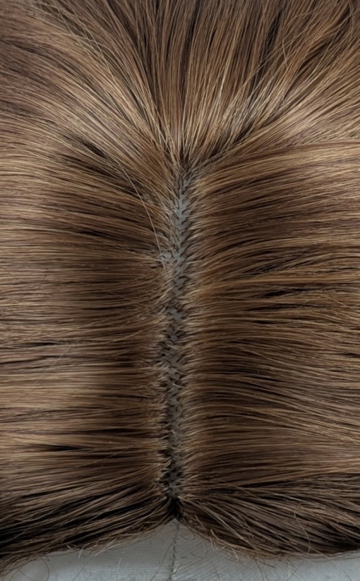 Tabitha - Lush Wigs UK A natural fringeless wig with a golden brown hue from roots to tips. Long lengths are styled into a relaxed flat iron wave. That leaves the ends of the hair sleek.