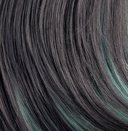 This dark brown and sage green wig has the best of both worlds. From the roots and fringe are a dark brown. Underneath lies a sage green for a peek-a-boo effect. Styled into a long sleek bob with layers for added volume.