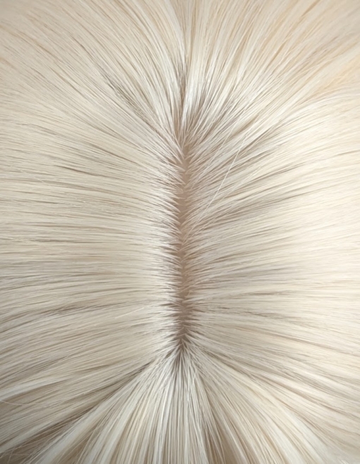 Waikiki - Lush Wigs UK This wig has a light golden blonde colour from roots to tips. It's styled sleek with large blow out curls at the ends for volume. A sleek blunt fringe frames the face.
