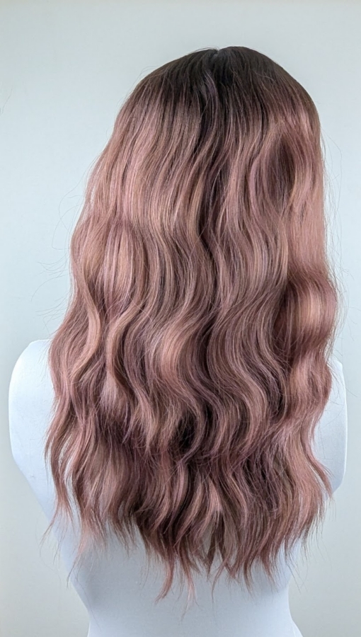 Yoake - Lush Wigs UK This wig has brown shadowed roots that blend into a mix of warm chocolate browns and dark pinks. They create this beautiful rosewood colour. Styled in a loose wave with subtle layers. The light fringe is sleek and blunt.