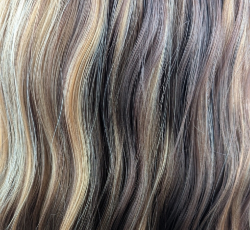 Addison - Lush Wigs UK A natural very long wig styled into loose waves throughout, with a sleek blunt fringe. Dark brown shadowed roots blend into a warm brown with high-lights to create this golden brown colour.