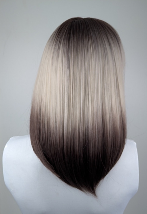 Argene - Lush Wigs UK A sleek natural Reverse Ombré long bob (lob) with a light fringe. Carries dark brown shadowed roots that blend into this pearl blonde colour with silvery grey undertones. Finished off with a block of chocolate brown at the tips.