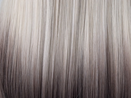 Argene - Lush Wigs UK A sleek natural Reverse Ombré long bob (lob) with a light fringe. Carries dark brown shadowed roots that blend into this pearl blonde colour with silvery grey undertones. Finished off with a block of chocolate brown at the tips.