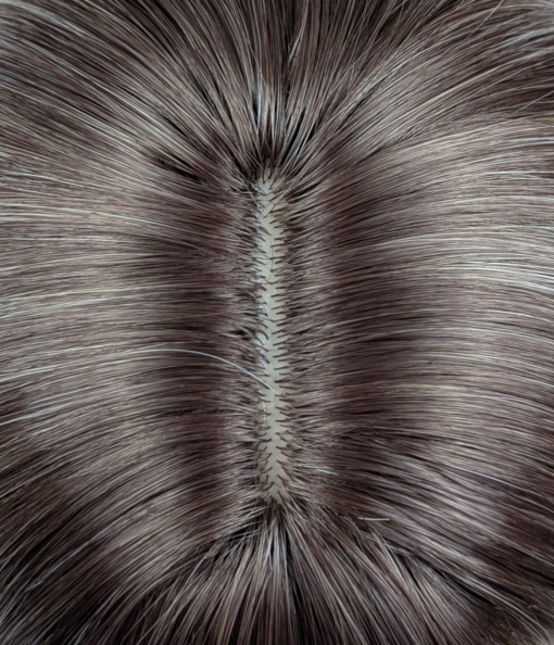 Argene - Lush Wigs UK A sleek natural Reverse Ombré long bob (lob) with a light fringe. Carries dark brown shadowed roots that blend into this pearl blonde colour with silvery grey undertones. Finished off with a block of chocolate brown at the tips.