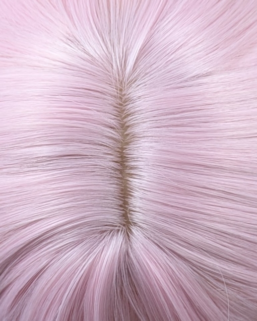 A mix of pastel pink from the roots that melt into a pastel green ombre. The style is sleek from the roots with a gentle wave for this one length long style. The fringe is long and sleek that can swept to the side or parted into curtain bangs.