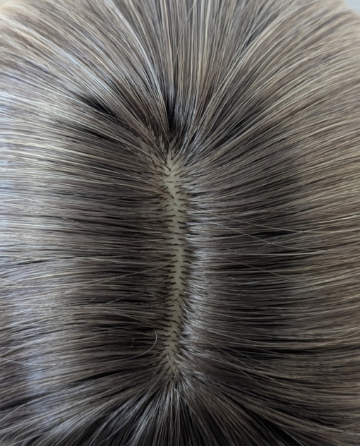 Ava - Lush Wigs UK A long and sleek wig with natural dark brown shadowed roots. They blend into a honey blonde with sterling blonde highlights. Styled into sleek long layers and a long fringe that can swept to the side or parted into curtain bangs.