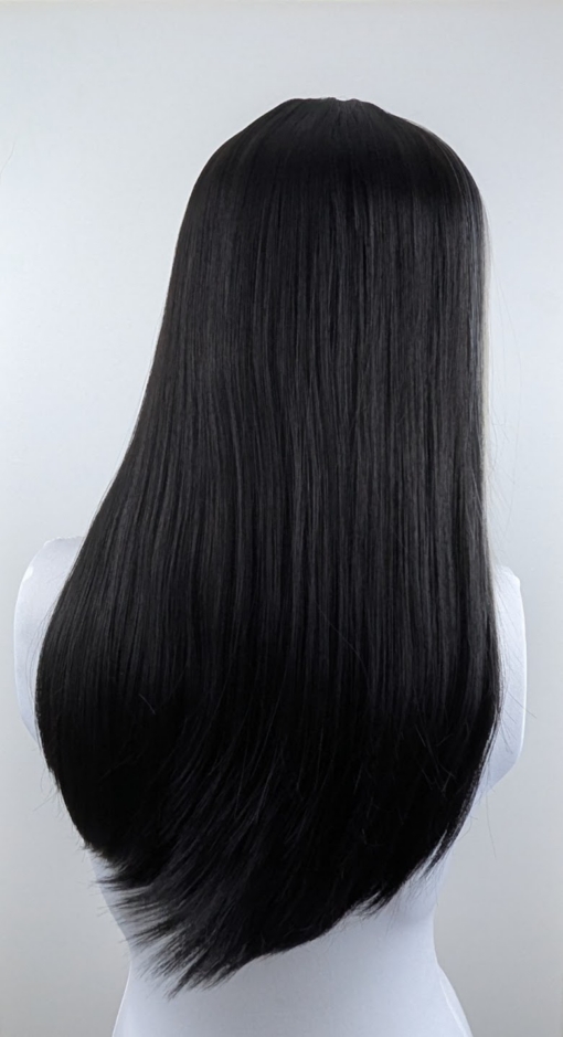 This sleek and dead straight long medium length style comes in a warm black colour. With a money-penny highlight of light grey in the fringe and each side of the face.