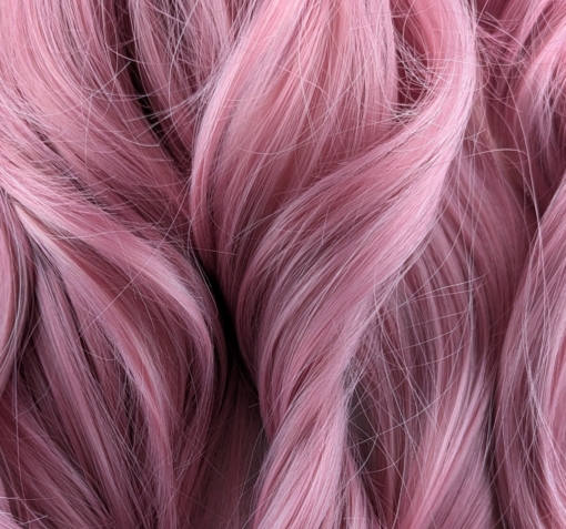 Bubblegum - Lush Wigs UK Pink from roots to tips. A blend of light pink and white stands of hair make this rose pink colour, from roots to tips. Styled in waves that fall to the waist. The light fringe finishes the look.
