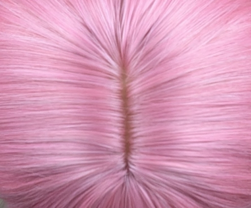 Bubblegum - Lush Wigs UK Pink from roots to tips. A blend of light pink and white stands of hair make this rose pink colour, from roots to tips. Styled in waves that fall to the waist. The light fringe finishes the look.