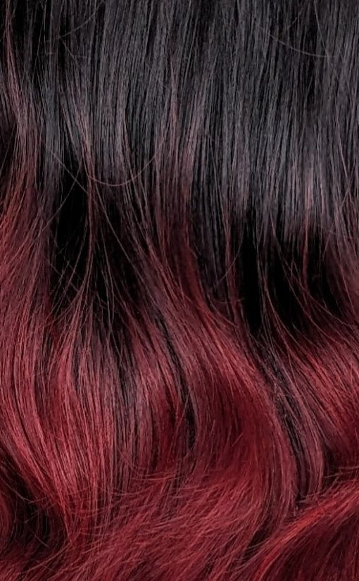 Cinnabar - Lush Wigs UK Black and red go together in perfect harmony. Cinnabar is our latest ombre of cool black and wine red. Styled in a blow out with long layers for movement. A blunt fringe frames the face.