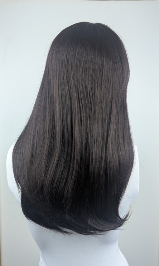 Dark Chocolate - Lush Wigs UK This natural wig is a mix of warm dark brown almost black colour. Styled sleek with long layers at the front. A full blunt fringe gives a full volume look to this medium-long layered style.
