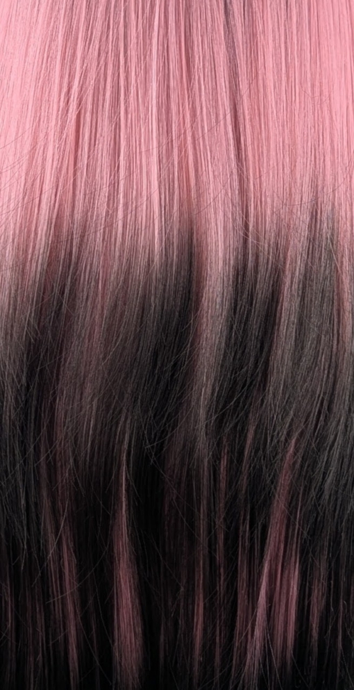 Dusk - Lush Wigs UK This Reverse Ombré natural twist wig is perfect for a subtle pop of colour. Soft black roots blend into a dusky pink hue with black ends. A sleek style with long layers at the back. With a full blunt fringe.