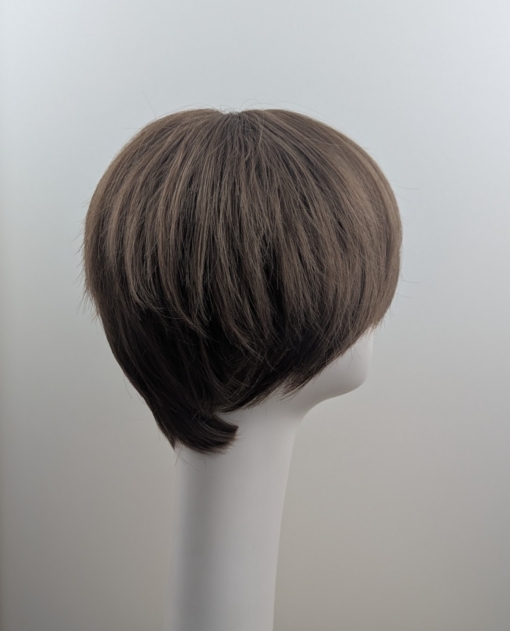 Elm - Lush Wigs UK A cute pixie cut in a light brown colour. Sleek short layers are blow dried with a large barrel brush. Wear it forward or swept to the side away from the face.