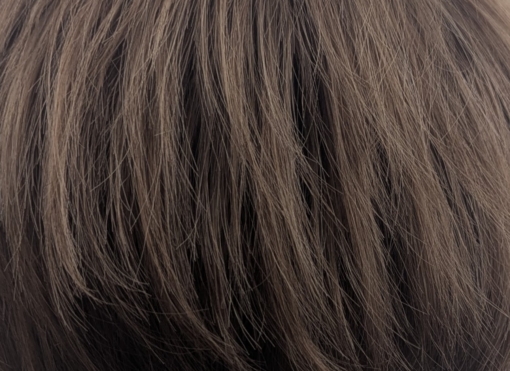 Elm - Lush Wigs UK A cute pixie cut in a light brown colour. Sleek short layers are blow dried with a large barrel brush. Wear it forward or swept to the side away from the face.