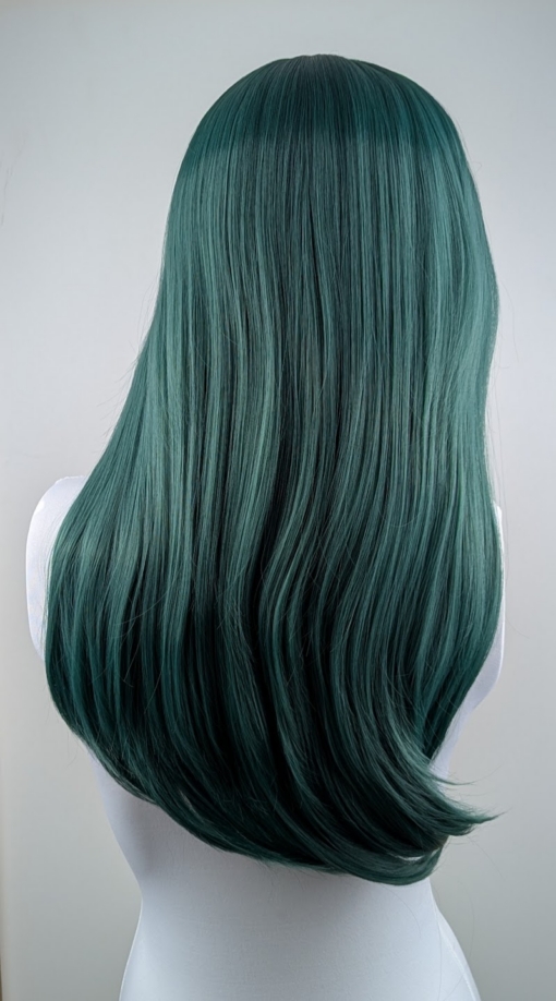This dark green wig from roots to tips. Styled sleek with long layers falling to the waist. The fringe is long and sleek, wear it to the side or parted for curtain bangs.