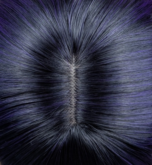 This Reverse Ombré natural twist of soft black and a deep purple pop of colour. Soft black roots blend into this purple hue with black tips. A sleek long style with long layers at the back that have a blow out look. Face framing layers at the front make this style easy to maintain. With a full sleek blunt fringe.