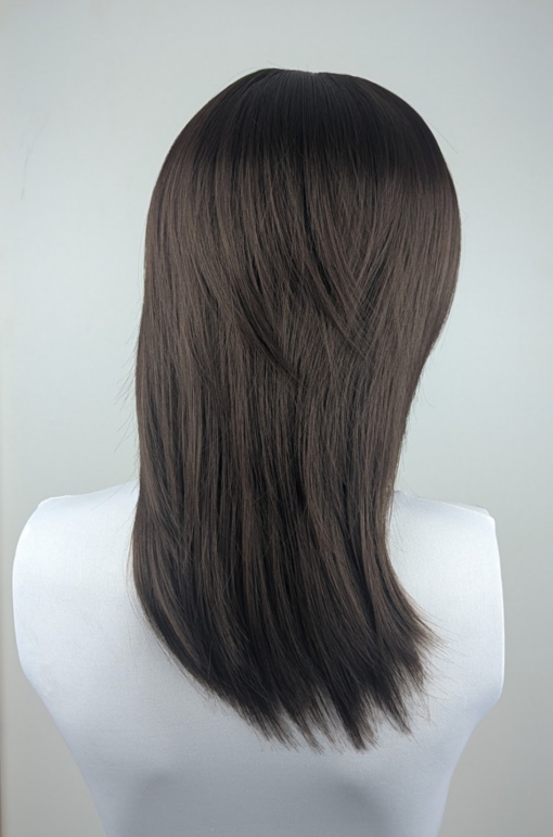 Kosaki takes the lob and turns it on its head. This shaggy sleek cut has body at the crown, with texture and movement around the face. A natural brunette colour.