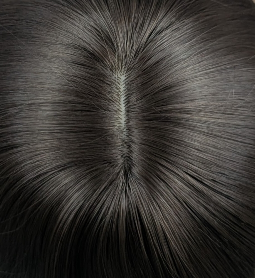 Kosaki takes the lob and turns it on its head. This shaggy sleek cut has body at the crown, with texture and movement around the face. A natural brunette colour.