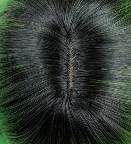 Lagoon - Lush Wigs UK Green and bold. Dark brown roots blend into this bright two tone green colour, with a slice of dark brown at the nape of the neck. For a peek-a-boo effect. Styled into a loose wave with a blunt fringe.