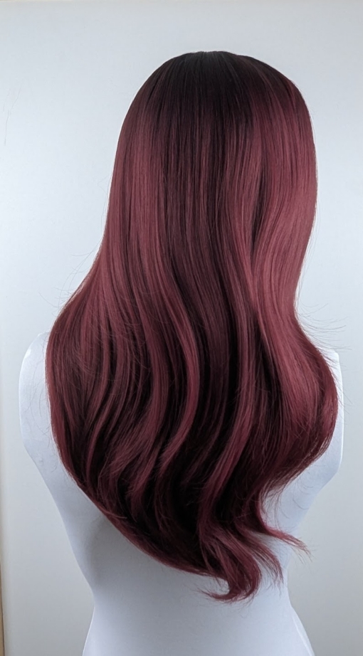 Rey - Lush Wigs UK This sleek style comes in muted merlot red wine colour with warm black shadowed roots for a natural feel. Cut into long layers that fall to the waist. Finished in a barrel brush blow out, with a lightweight sleek fringe.