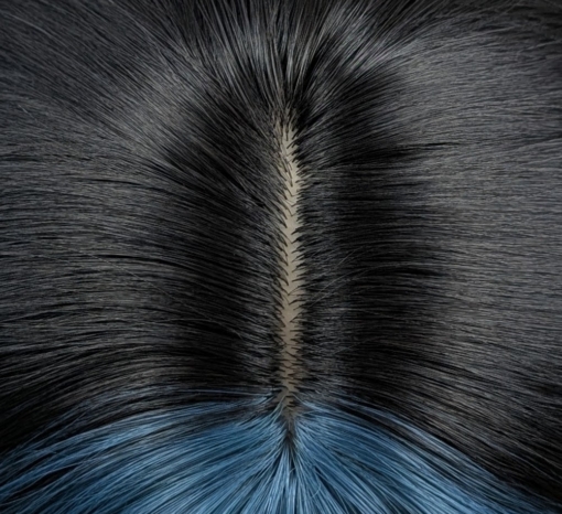 This wavy dark brown bob comes to life with a face framing peek-a-boo slice of denim blue colour. Thats carried into the blunt sleek fringe.